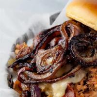 Cowboy Pulled Pork · Pulled pork topped with pepper jack, hardwood smoked bacon, and grilled onion. Includes Swee...