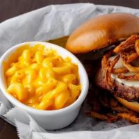Brisket Melt · Slow-smoked beef brisket served on a toasted bun, topped with provolone and crispy onion cur...