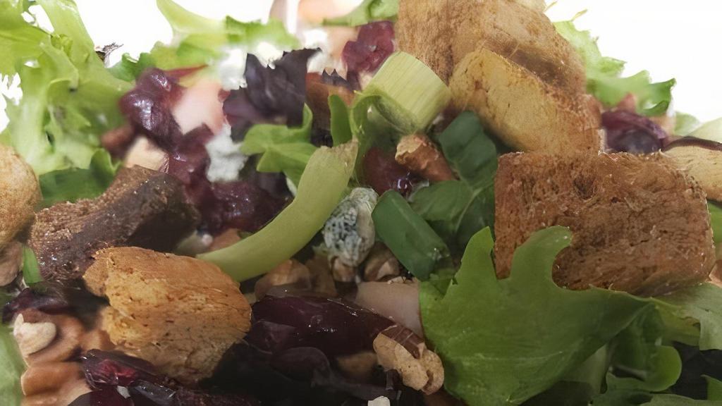 Turkey Berry Bleu Salad · Our tender smoked turkey atop a mound of romaine/iceberg mix sprinkled with dried cranberries, pecans, bleu cheese crumbles, green onion, and croutons. Great with housemade sweet orange vinaigrette and balsamic dressings, or poppyseed dressing.