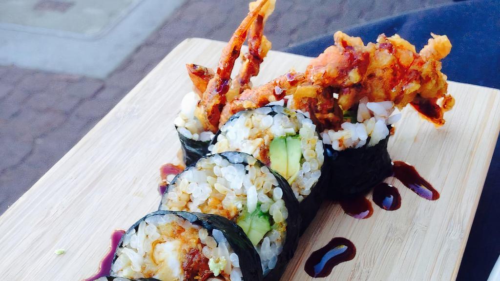 Spider Roll · Tempura fried soft shell crab, cucumber, massage and mayo atop eel sauce.