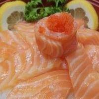 Sakadon Dinner · Salmon sashimi over sushi rice served with soup and salad.