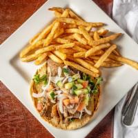 Gyros Sandwich · Shaved lamb and beef gyros served with tomato, cucumber, onion and choice of pita with side ...