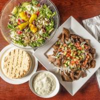 Gyros Meal Deal · Thinly sliced gyros with Greek salad, pita bread, and sauce.