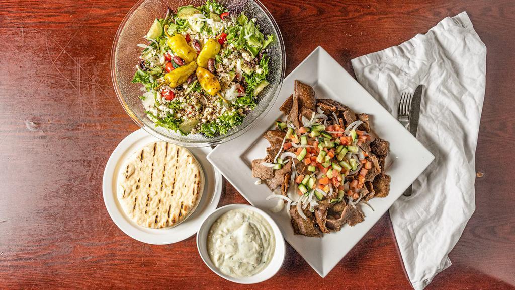 Gyros Meal Deal · Thinly sliced gyros with Greek salad, pita bread, and sauce.