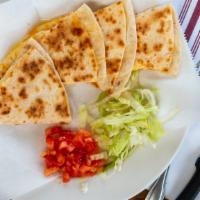 Quesadailla · Large flour tortilla filled with cheese and your choice of meat.