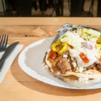 Gyros · Pita bread with choice of one protein housemade sauce fresh vegetables and cheese.