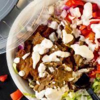 Steak Shawarma Bowl · Served on your choice of rice with a side of half pita bread.