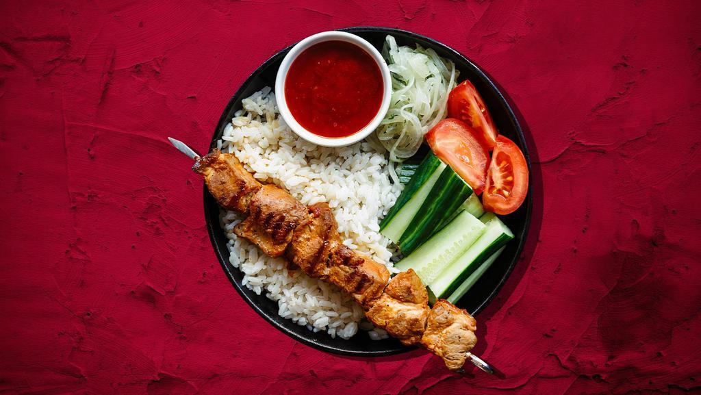 Chicken Kebab Plate Champion · Traditionally marinated chicken thigh, served with rice, grilled vegetables and your choice of side sauce.