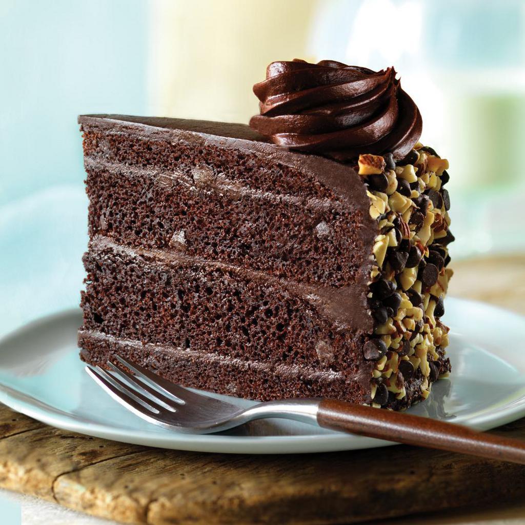 Cheesecake Factory Bakery Chocolate Black-Out Cake · The Cheesecake Factory Bakery® deepest, richest chocolate cake baked with dark chocolate chips, layered and topped with a decadent chocolate black-out icing. Finished with almonds and magical chocolate rosettes.