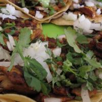 Taco (Beef) · Beef, onion and cilantro.