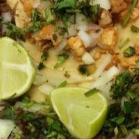 Taco (Chicken) · Chicken, Onion and cilantro.