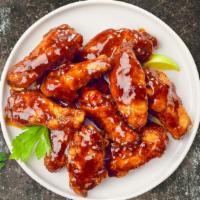 Bbq Chicken Wings · Fresh chicken wings breaded, fried until golden brown, and tossed in barbecue sauce. Served ...