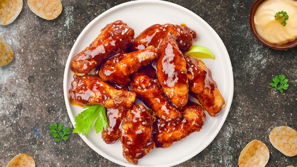 Bbq Chicken Wings · Fresh chicken wings breaded, fried until golden brown, and tossed in barbecue sauce. Served with a side of ranch or bleu cheese.