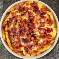 Bacon Cheese Fries · Idaho potato fries cooked until golden brown and garnished with salt, melted cheddar cheese,...