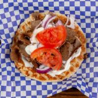 Gyro On Pita · Thinly Sliced Gyro Strips Served on Pita Bread with Tomato, Onion and Gyro Sauce