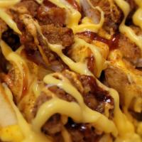 Loaded Cheese Fries With Gyro · Crispy cut potato fries topped with cheddar cheese sauce, Burger sauce, Peri BBQ sauce & Thi...