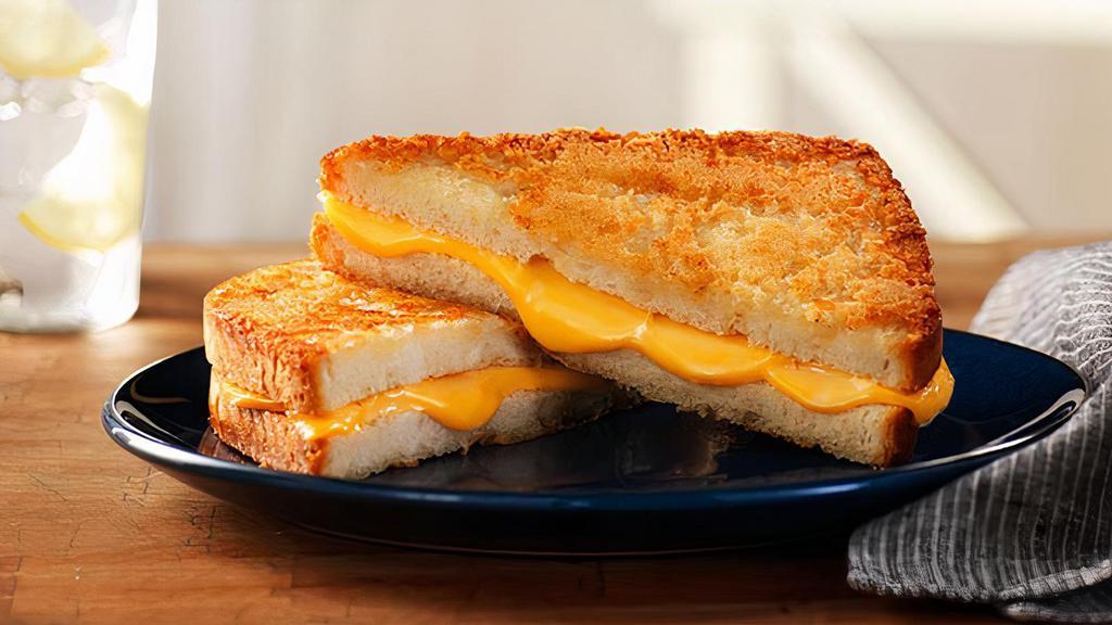 Parmesan Crusted Regular Grilled Cheese · Regular Grilled Cheese on Parmesan Crusted Sourdough. Includes Chips