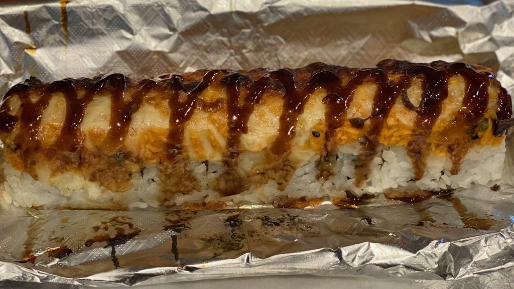 Smoky Roll · Spicy. Spicy tuna, tempura shrimp, cream cheese, avocado, topped with spicy crab, mozzarella cheese and eel sauce.