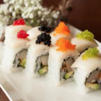 Snow White Roll · Spicy yellowtail, avocado, and topped with escolar and tobiko.