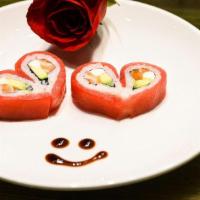 Valentine’S Roll · Eel, avocado, masago, and topped with tuna and eel sauce.