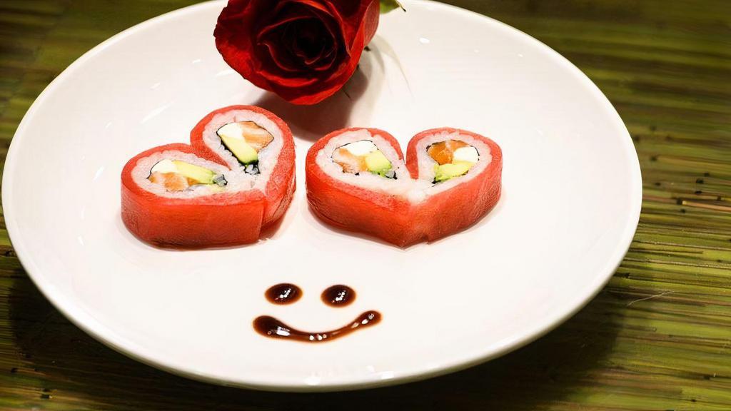 Valentine’S Roll · Eel, avocado, masago, and topped with tuna and eel sauce.