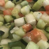 Israeli Salad · Diced tomato, cucumber, onion, lemon juice.
