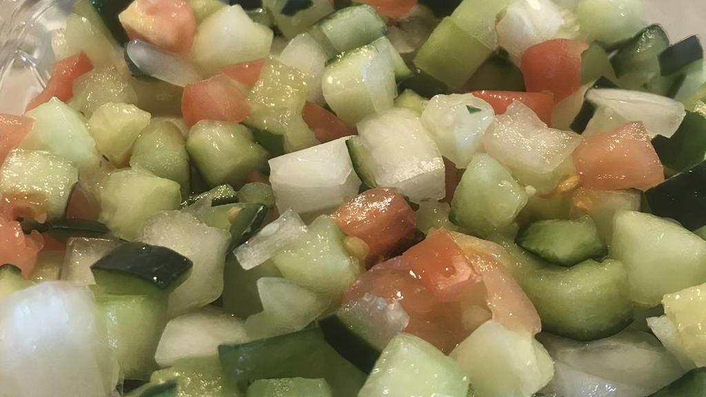Israeli Salad · Diced tomato, cucumber, onion, lemon juice.
