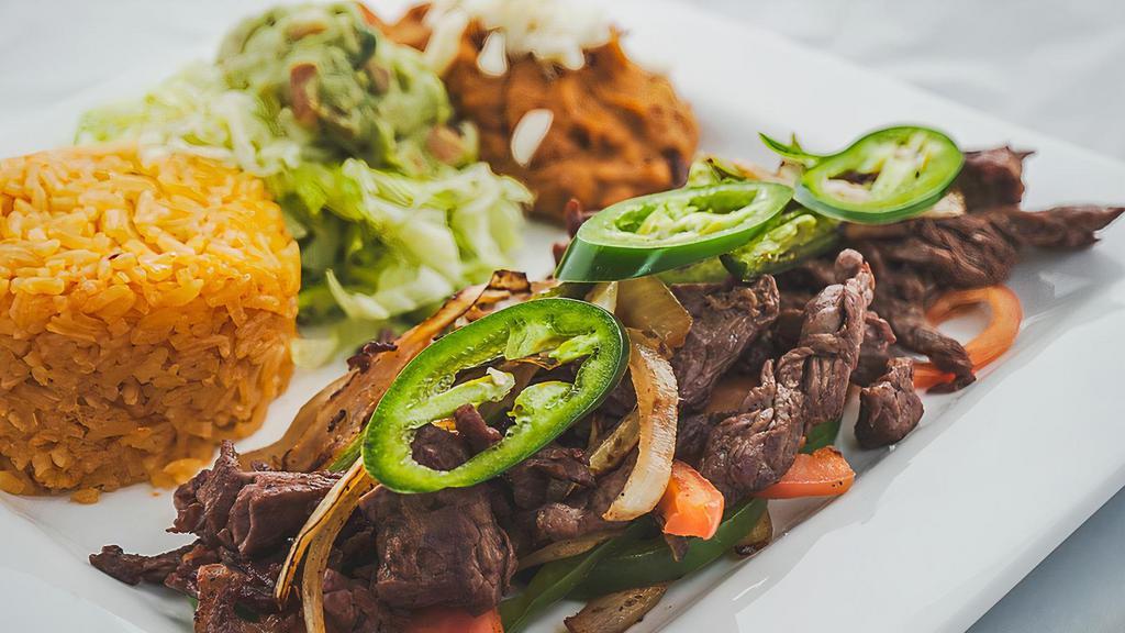 Asada La Mexicana · Charbroiled steak topped with onions, tomatoes, and jalapeño peppers. served with rice, beans, and guacamole salad.