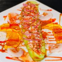 Pepinazo Loco · Cucumber filled with avocado, tajin, and our chef's signature hot sauce.