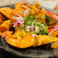 Molcajete Ale · Mussels, shell-on shrimp, peeled shrimp, crab meat, scallops, octopus, and crawfish topped w...