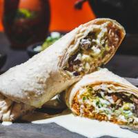 Burrito Pariente · Flour tortilla filled with your choice of steak or grilled chicken, beans rice, lettuce, sou...