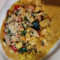 *Chicken Curry · Sautéed chicken, onion, leek, mushroom and vegetables in a light curry cream sauce over rice.