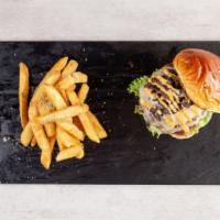 Mushroom Swiss Burger · Certified angus beef, aged swiss cheese, sautéed mushrooms, burger sauce.