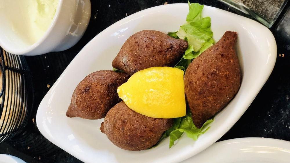 Fried Kibbee (4) · Sautéed ground meat and onions, stuffed in kibbee balls and fried in vegetable oil.