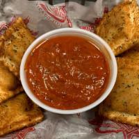 Toasted Ravioli · 8 Sausage and Cheese Ravioli Fried to Perfection and served with Our Housemade Marinara