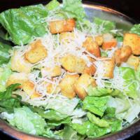 Caesar Salad Side · Romaine Lettuce, Croutons, and Shredded Parmesan Cheese served with a Classic Caesar Dressing.