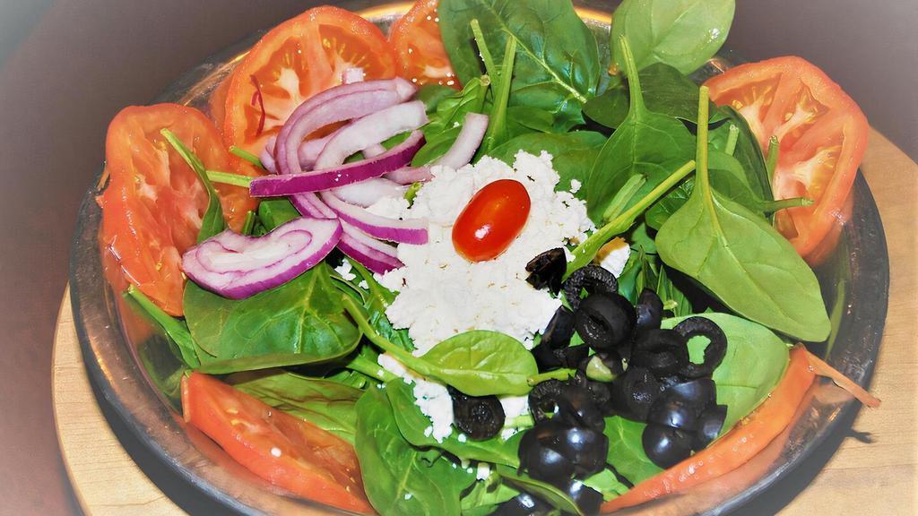Mediterranean · Sliced Tomatoes, Fresh Baby Spinach, Black Olives, Feta Cheese, Red Onions served with your choice of Dressing. We recommend Balsamic Vinaigrette.