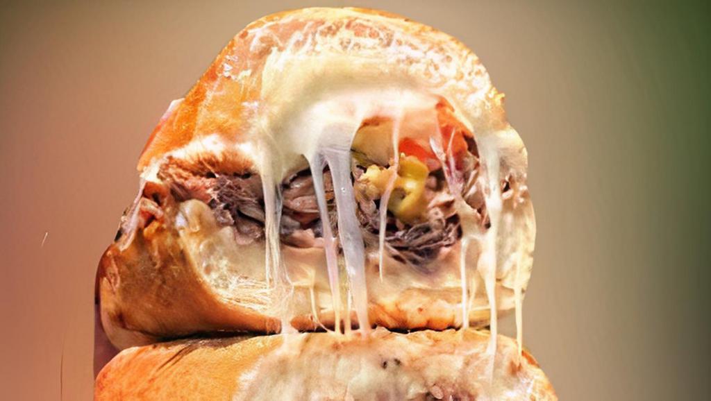 Italian Beef · Italian Beef with pepper cheese sauce topped with shredded mozzarella cheese. Served with fries