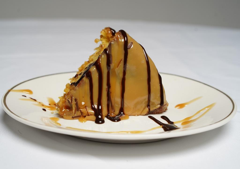 Caramel Cake · One slice. Moist yellow cake covered with a homemade caramel.