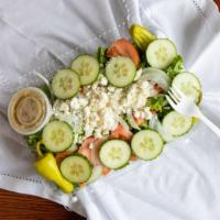 Greek Salad · Lettuce, tomatoes, onions, cucumbers, pepperoncini, feta cheese, Greek dressing, served with...