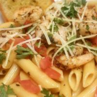 Shrimp Scampi Pasta · Jumbo shrimp with penne pasta, fresh diced tomatoes, tossed in a garlic butter sauce. Topped...