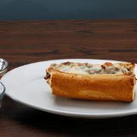 The Cheesy Beef Sandwich · Our delicious home cooked Italian beef on fresh French bread smothered with melted cheese.