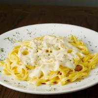 Fettuccine Alfredo Pasta · Pasta with cream and cheese sauce. Served with marinara or meat sauce, garlic bread, and gra...