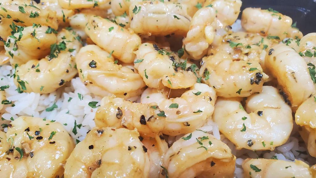 Garlic Butter Shrimp · Shrimp cooked in garlic, butter, and lemon juices served with 2 sides of your choice.