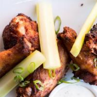 Smoked Chicken Wings · Our signature house-smoked wings served with celery and your choice of ranch or blue cheese....