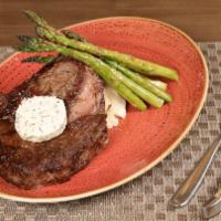 Ribeye · Garlic mashed potatoes, grilled asparagus, herb compound butter.