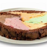 Rainbow Cake Roll Slice · Single slice of chocolate cake rolled with five flavors of the Rainbow Cone  **Contains Nuts**
