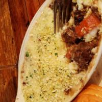 Braised Beef Shepherd'S Pie · Slow-cooked in Guinness & red wine with peas, carrots, celery & onion. Baked under a mashed ...