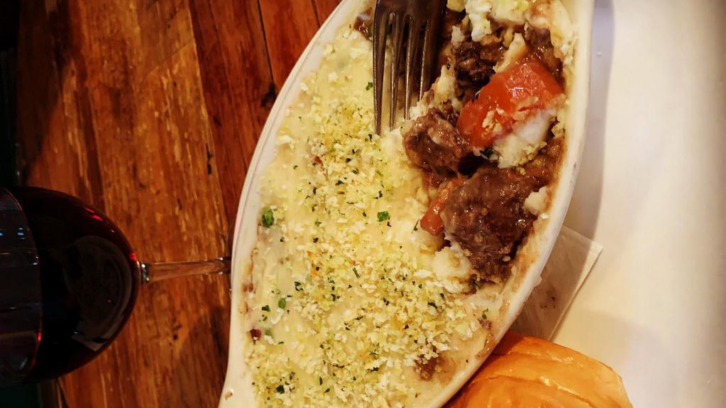 Braised Beef Shepherd'S Pie · Slow-cooked in Guinness & red wine with peas, carrots, celery & onion. Baked under a mashed potato & bread crumb crust.