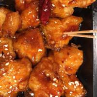 Sesame Chicken (Small) · Hot and spicy. Deep fried battered chicken, sautéed with minced garlic in a rich sesame spic...